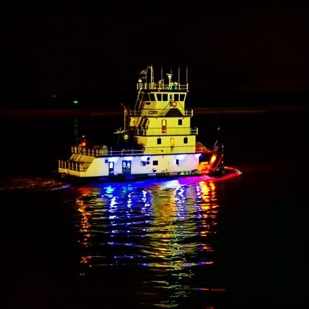 Tugboat with colored reflections