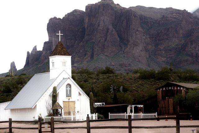 Church beneath desert cliffs